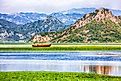 Awesome view of Skadar Lake surrounded by green mountain peaks in Skadar Lake National Park, Montenegro.