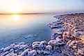 Salt on the shore of the Dead Sea. Jordan sunset landscape