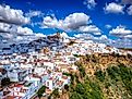Panoramic of Arcos de la Frontera, white city built on a rock along the Guadalete river, in the province of Cádiz, Spain. 