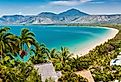 Port Douglas beach and ocean on sunny day, Queensland, Australia. Part of the Great Barrier Reef Drive.