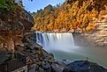 Cumberland Falls surrounded by autumn colors in Cumberland Falls State Resort Park, Kentucky.