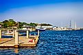 People on a landing dock for Cumberland Island at St. Mary's in Georgia, USA, via csfotoimages / iStock.com