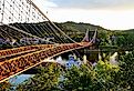 Barge going under the Famous Suspension Bridge at Wheeling, West Virginia.