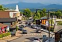 Main Street in downtown Lake Placid, Upstate New York with the mountains in the distance. Image credit Karlsson Photo via Shutterstock.