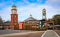 Downtown Covington, Louisiana, showcasing redevelopment and growth with newly renovated buildings and active street scenes. Editorial credit: Wirestock Creators / Shutterstock.com
