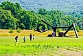 Mountainville, New York/United States-7/7/2019: tourists visiting new addition of sculpture of “she” by Mark DI Suvero in storm king art center. Yingna Cai via Shutterstock