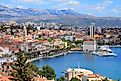 The stately Old Town facade of Split, Croatia, backdropped by the Dinaric Alps and met by the Adriatic Sea.