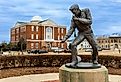 Elvis Presley Statue in Tupelo, Mississippi, with City Hall in the background. Image credit Chad Robertson Media via Shutterstock