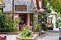 Quaint ivy covered shops in Carmel by the sea, city on the Pacific coast known for its enchanting architecture.. Image credit: J Wendy Baker via Shutterstock