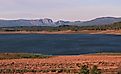 Late afternoon sun settling in over Lake Heron in New Mexico with views of the mountains in the distance. 