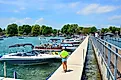 Pier and boats docked in the Skaneateles Lake, one of the Finger Lakes, via PQK / Shutterstock.com