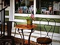 Small table and chairs outside retail shop in Bell Buckle, Tennessee. Image: Janlovespix / Shutterstock.
