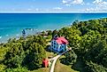 Grand Traverse Light at the tip of the Leelanau Peninsula, Michigan, which separates Lake Michigan and Grand Traverse Bay. (Editorial credit: Dennis MacDonald / Shutterstock.com)