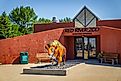 Entrance to the Red River Zoo in Fargo, North Dakota, with a buffalo sculpture visible on a sunny day. Editorial credit: Photo Spirit / Shutterstock.com