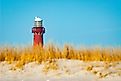 Barnegat Lighthouse on a bluebird day. (Editorial credit: Cavan-Images / Shutterstock.com)