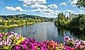 A group of kayakers enjoy a beautiful summer day on Sand Creek River and Lake Pend Oreille in the downtown area of Sandpoint, Idaho, USA.