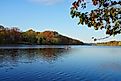 View of people kayaking in the fall on Lake Carnegie in Princeton, New Jersey. Editorial credit: EQRoy / Shutterstock.com