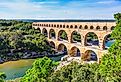 Three-tiered aqueduct Pont du Gard, built in Roman times on the River Gardon.