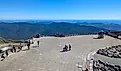  Tourists standing on the observation deck at the summit of Mount Washington. Editorial credit: travelview / Shutterstock.com