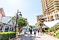 Pirate's Alley on Harbor Boardwalk during sunny day in Destin, Florida. Image credit Kristi Blokhin via Shutterstock
