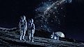 An Image of Two Astronauts Walking on the Surface of the Moon