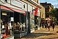 Two adult women window shop along the Main Street in Cold Spring, New York, via Kirkikis / iStock.com