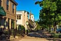 Churches and businesses line a shady block of Broadway Avenue in Granville, Ohio. Image credit Kenneth Sponsler via Shutterstock