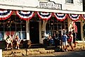 People gather and talk to friends in front of the general store in Brewster, Massachusetts, on Cape Cod, on a sunny summer day. Editorial credit: James Kirkikis / Shutterstock.com