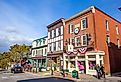 Storefronts and visitors in downtown Bar Harbor, Maine. Editorial credit: f11photo / Shutterstock.com
