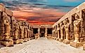 The statues of the Great Temple of Amun at sunset, with the stunning Karnak Temple in Luxor, Egypt