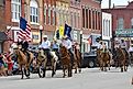 Horseback riders in a parade in Council Grove, Kansas. Image credit Mark Reinstein via Shutterstock