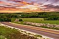 The sun sets on a ranch in the Flint Hills of Kansas