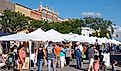 Crowds on a sunny day enjoying an art fair on Main Street in Howell, via NCSchneider_Images / Shutterstock.com