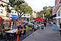 View of people eating on outdoor patios on Witherspoon Street in downtown Princeton, New Jersey, United States.