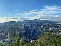 Seoul’s mountain backdropped skyline as seen from halfway up Namsan Mountain on a sunny day. Credit: Andrew Douglas