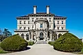 The building's exterior, framed by topiaries. Photo via Wikicommons