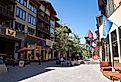 View of the Village at Mammoth Lakes, a pedestrian friendly shopping area with restaurants. Image credit melissamn via Shutterstock.