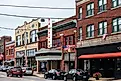 Westerly, Rhode Island: High Street with colourful buildings and a few people. via peeterv / iStock.com