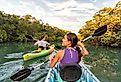 Couple kayaking together in the Everglades, Florida.