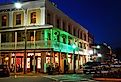 The lights of the stores in downtown Oxford, Mississippi begin to glow at twilight. Image credit James Kirkikis / Shutterstock.com