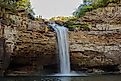 Hikers rappelling down DeSoto Falls in Northeast Alabama.