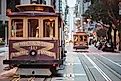 A cable car travels California, Van Ness and Market Streets. Via Shutterstock / Connect Images-Curated