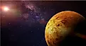 Venus, the slowest-spinning planet in the Solar System, illuminated against the Sun and stars.