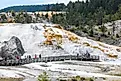 Tourists visiting Palette Spring Terrace at Mammoth Hot Springs in Yellowstone National Park.
