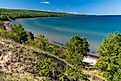 A high angle of Great Sand Bay of Lake Superior covered with greenery on Keweenaw peninsula, Michigan. 