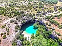 Aerial drone view of Hamilton Pool in Dripping Springs Texas.