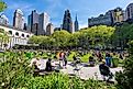People relaxing at Bryant Park in Midtown Manhattan. Editorial credit: ymgerman / Shutterstock.com