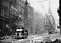 Ludgate Hill area of London with firemen, equipment, and burnt out buildings during the 'Blitz'. Between September 1940 and May 1941, Nazi Germany bombed British cities.