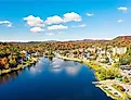 Colorful aerial view of Saranac Lake New York in the Adirondack Mountains during the fall.
