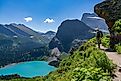 A hiker admiring the scenic landscape in Glacier National Park, Montana.